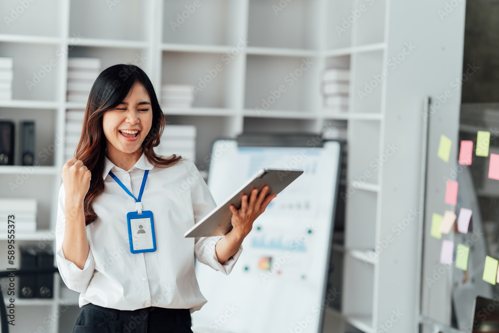 Young woman happy and screaming because of problems with documents in the office. Young woman happy and screaming because of problems with documents in the office.
