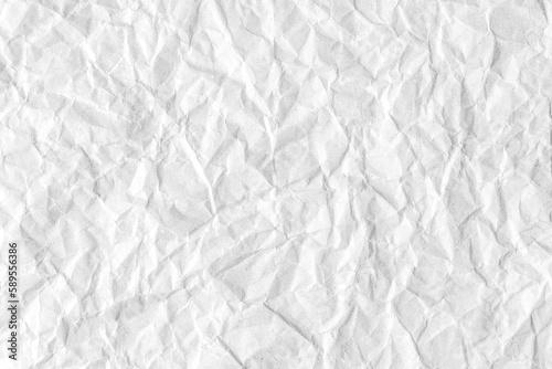 Recycled crumpled white paper texture background. Wrinkled and creased abstract backdrop, wallpaper with copy space, top view.