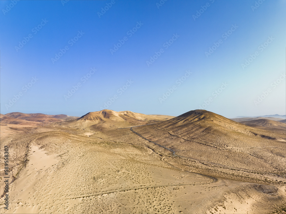 View from above, stunning aerial view of a mountain landscape during a sunny day. Costa Calma, Fuerteventura, Canary Islands.