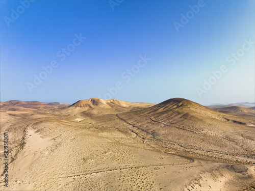View from above, stunning aerial view of a mountain landscape during a sunny day. Costa Calma, Fuerteventura, Canary Islands.