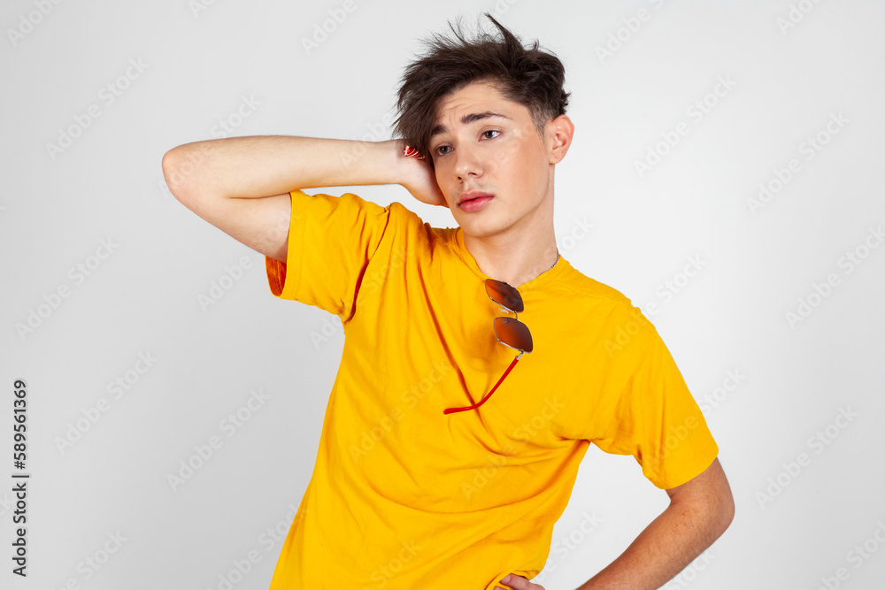 A young guy addicted to sweets, candies and sugar. Isolated on white background. copy space.