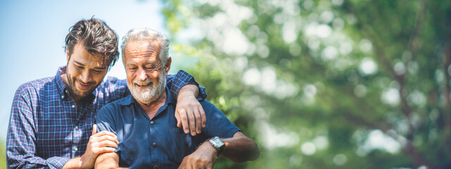Adult hipster son fun hugging old senior father at home, two generations have a beard talking together and relaxing with smile, 2 man happy enjoy to living at home in father's day with love of family