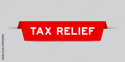 Red color inserted label with word tax relief on gray background