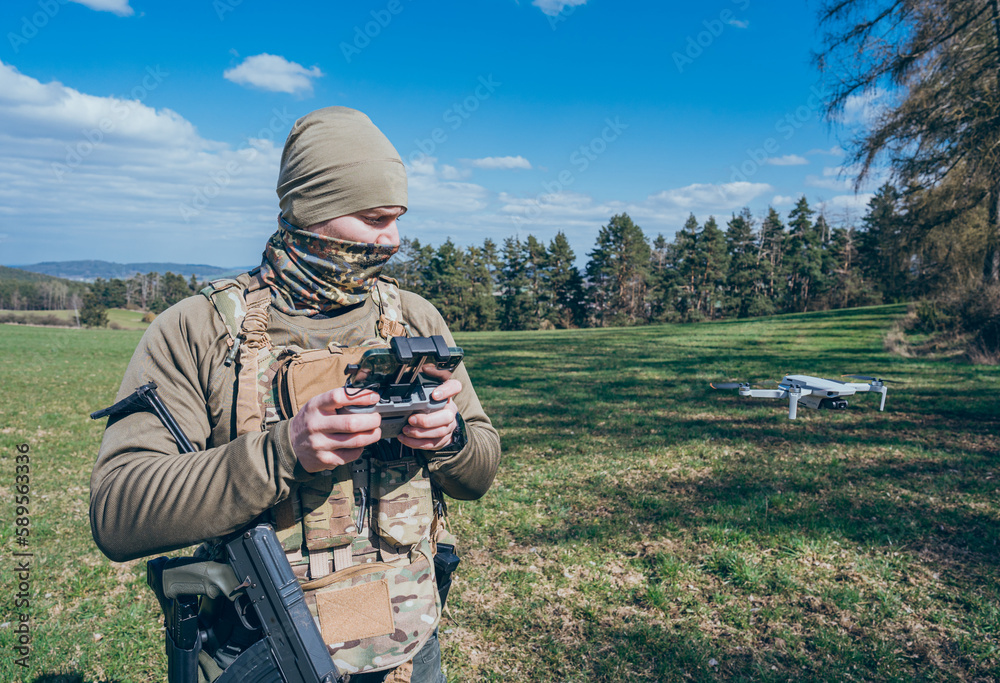 Modern army soldiers using aerial drone for artillery guidance and ...