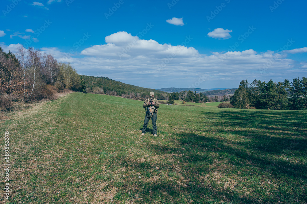 Modern army soldiers using aerial drone for artillery guidance and scouting view enemy positions in military operation. Modern army soldiers using aerial drone for artillery guidance and scouting view enemy positions in military operation.