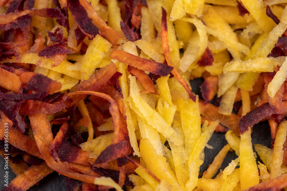 Finely grated red-orange carrots in the kitchen Finely grated red-orange carrots in the kitchen
