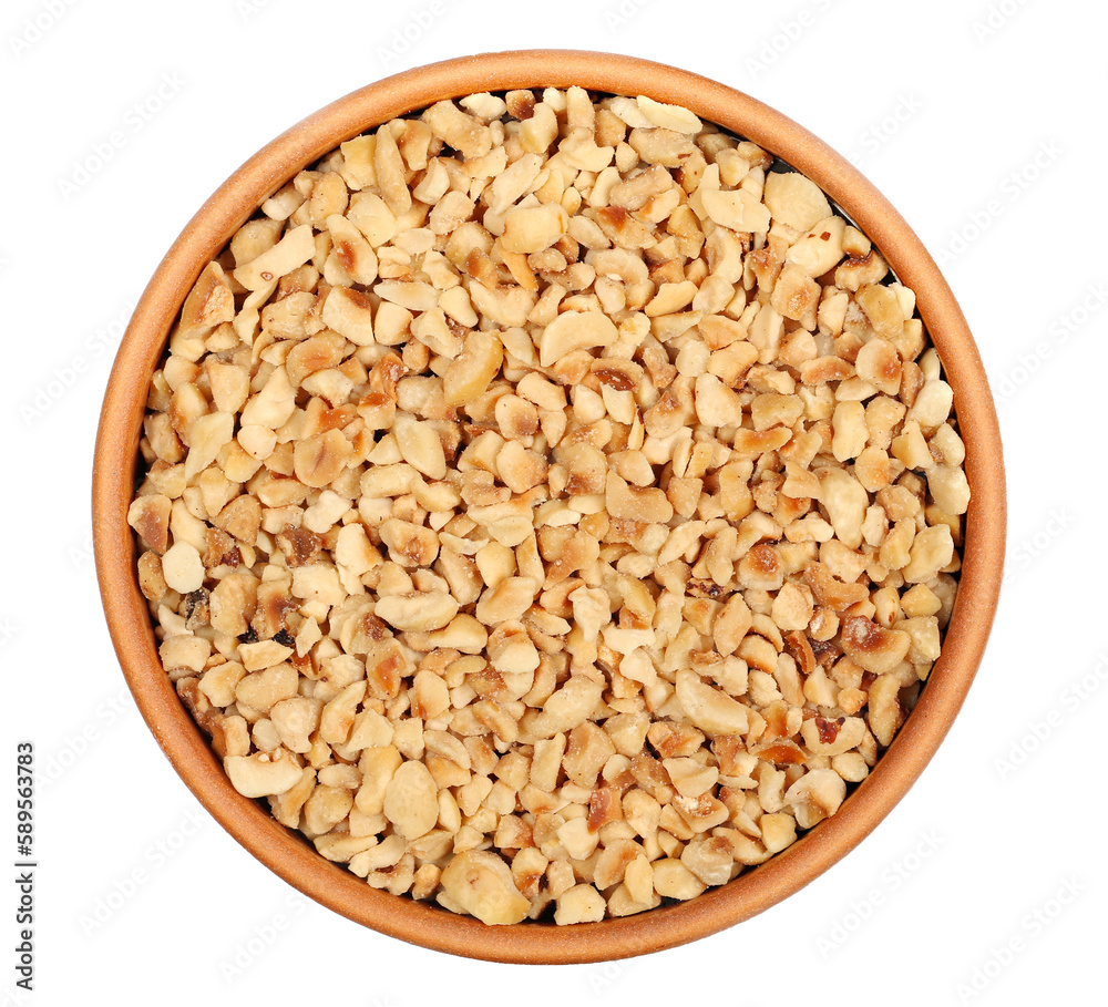 Chopped and roasted hazelnut in clay pot isolated on white, top view Chopped and roasted hazelnut in clay pot isolated on white, top view