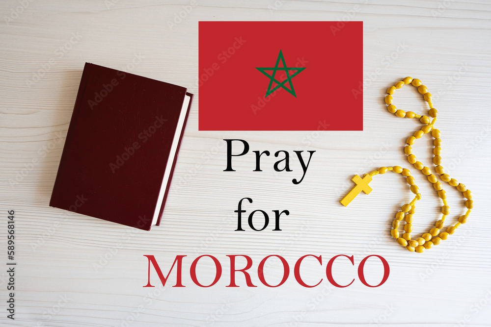 Pray for Morocco. Rosary and Holy Bible background.