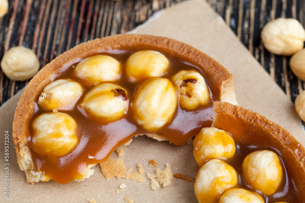 round tartlet with salted caramel and roasted hazelnuts round tartlet with salted caramel and roasted hazelnuts