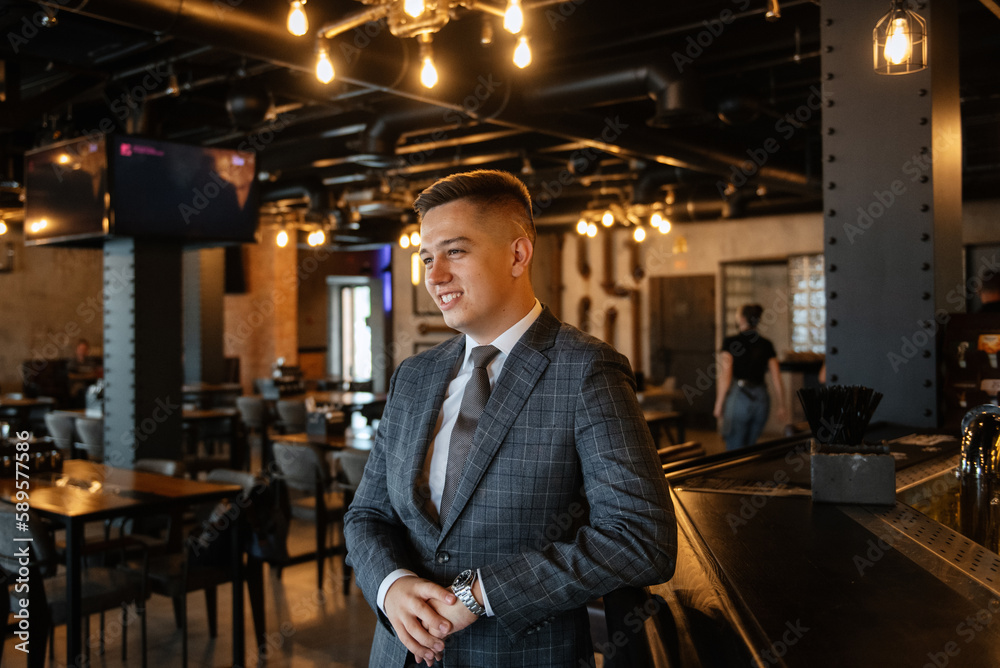 portrait of a groom in a gray plaid suit with a tie portrait of a groom in a gray plaid suit with a tie