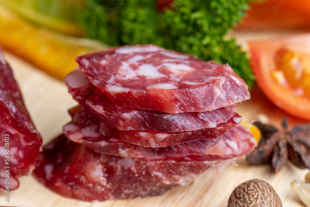 sliced sausage from pieces of meat with bacon sliced sausage from pieces of meat with bacon