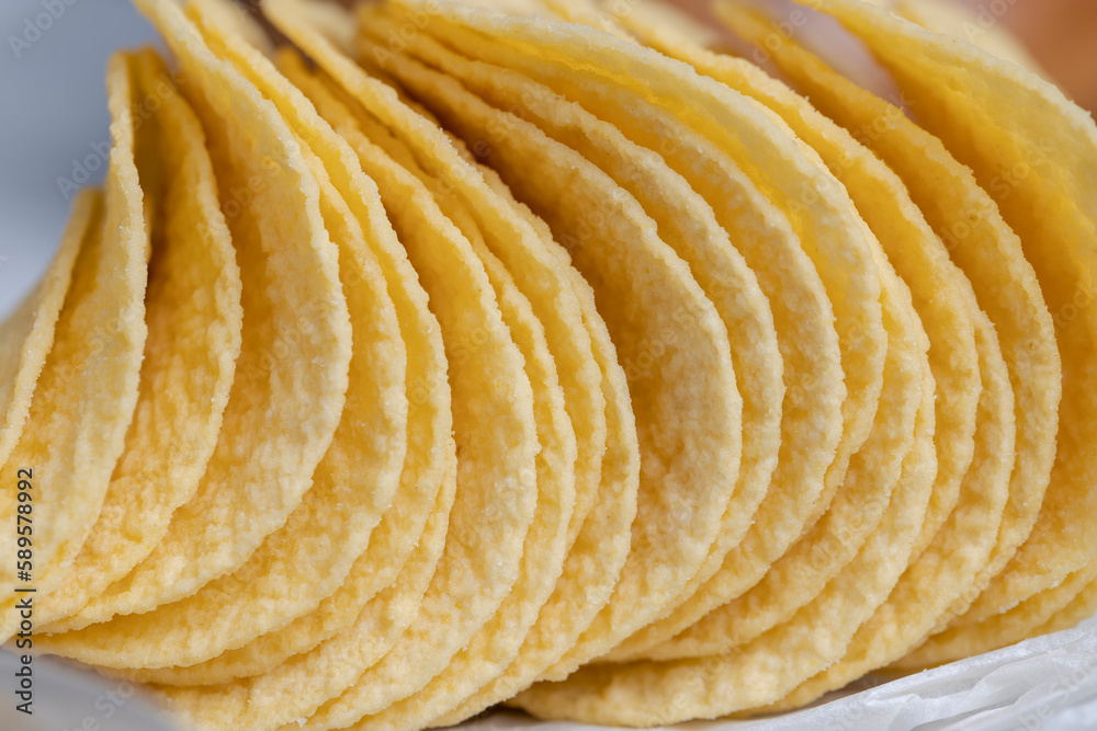 thin potato chips with spices, close up thin potato chips with spices, close up