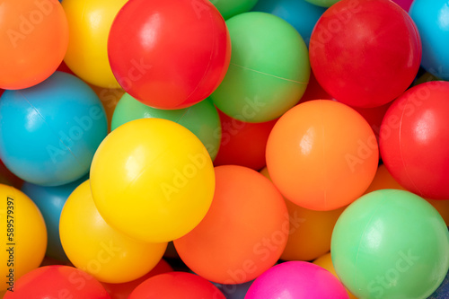 Colorful child balls. Multi-colored plastic balls on playground. 