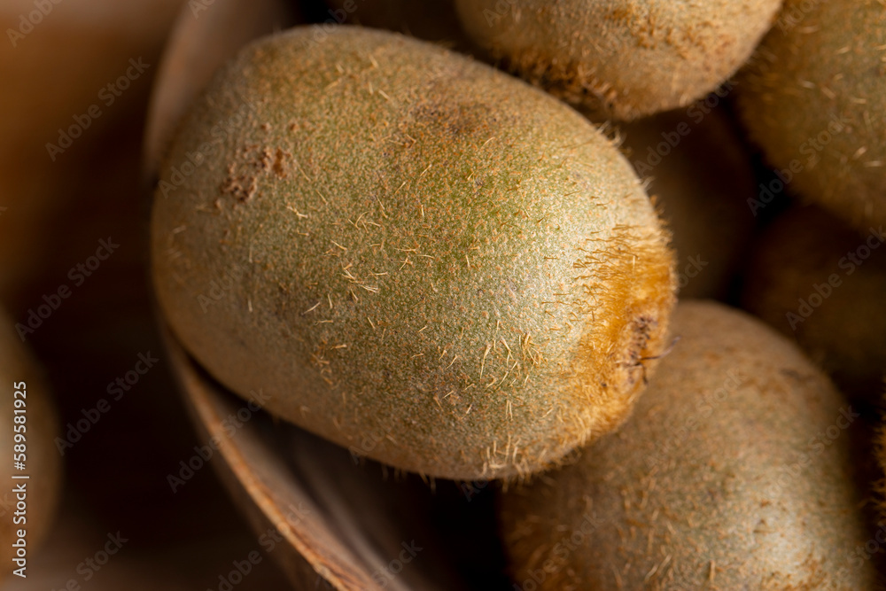 A group of whole green kiwi fruits not peeled A group of whole green kiwi fruits not peeled
