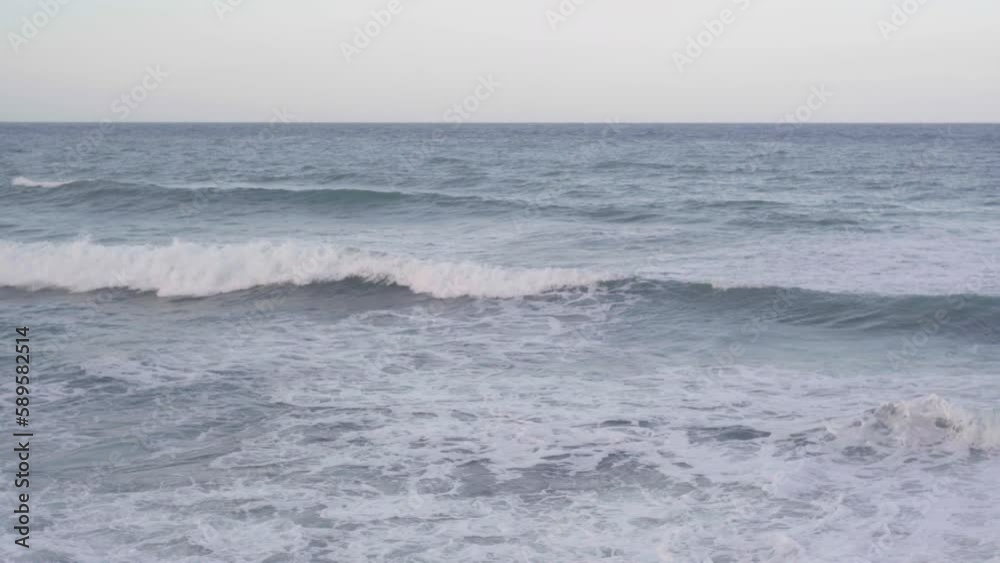 Wide shot Mediterranean sea waves rolling with white foam outdoors. Ocean horizon on Cyprus Wide shot Mediterranean sea waves rolling with white foam outdoors. Ocean horizon on Cyprus