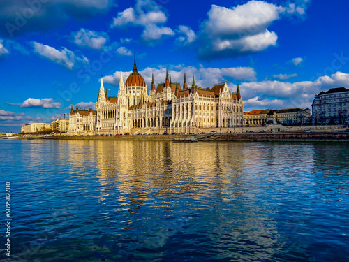 View of Parliament building of Budapest from the Danube river. neo-gothic style architecture.