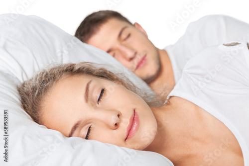Young couple sleeping on the bed in bedroom