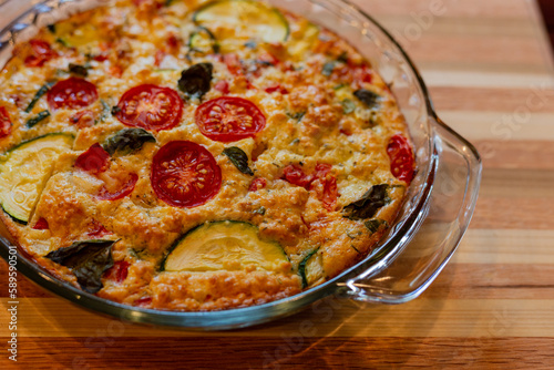 Close-up of homemade tomato and zucchini pie for dinner at home.