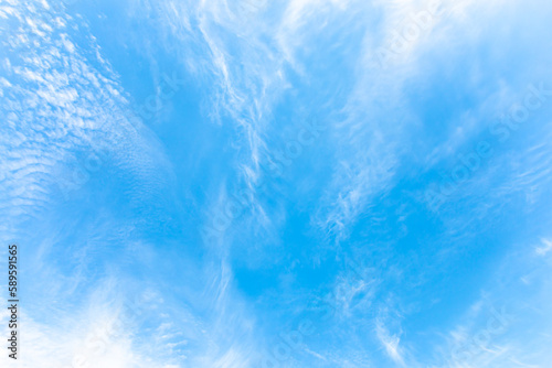 Slika na platnu Beautiful white abstract cirrus clouds as if they diverging away from the center on blue sky
