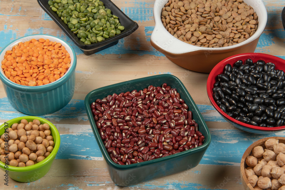 assorted bowls with raw grain and seeds top view