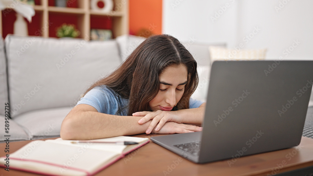 Young beautiful hispanic woman using laptop stressed at home Young beautiful hispanic woman using laptop stressed at home