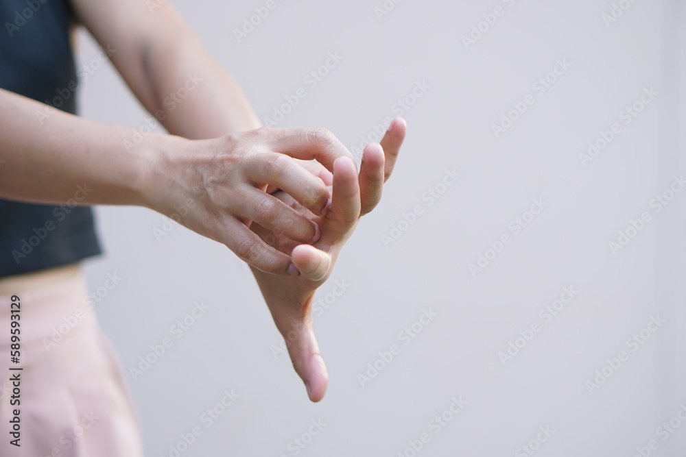 Asian woman having itchy hands Asian woman having itchy hands