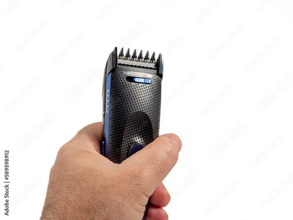 Φωτογραφία Hair clipper in hand isolated on white background