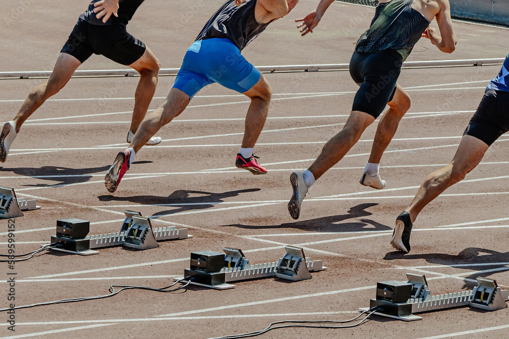 athlete runners beginning speed running 100 - meter race in summer athletics championships