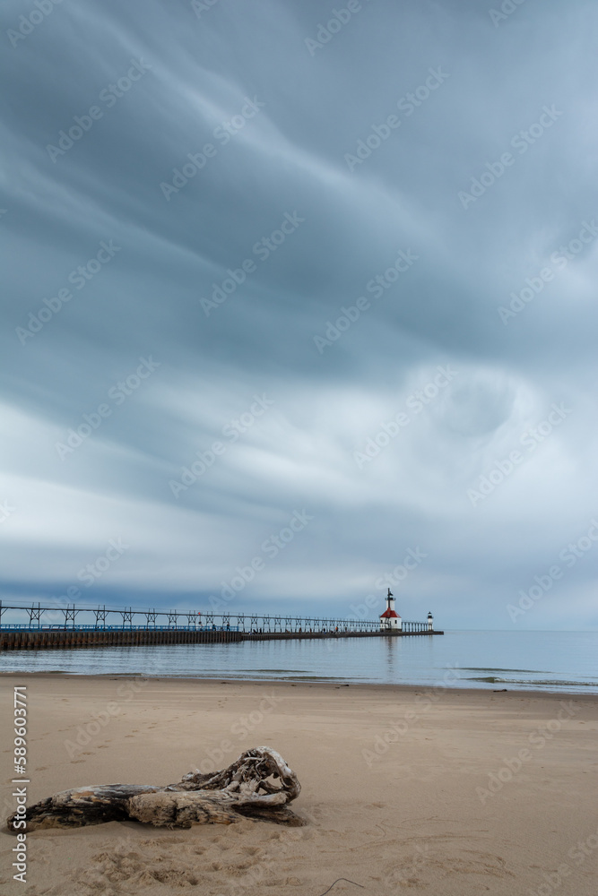 Storm clouds approaching St. Joseph lighthouse and beach.  St. Joseph, Michigan, USA.