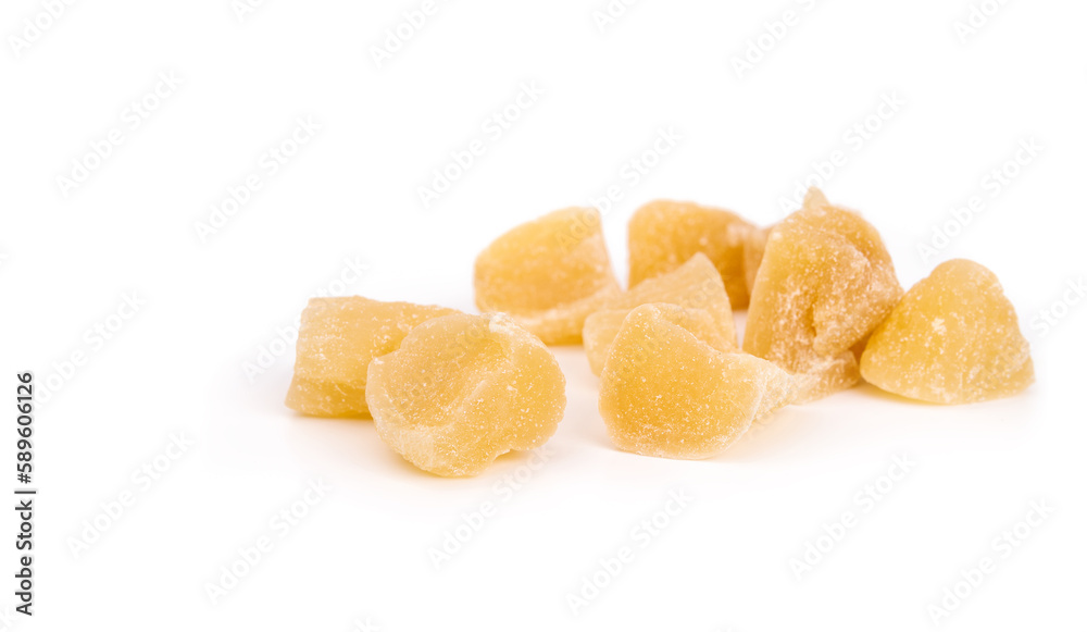 Candied ginger pieces in random pile. Many yellow chunks of candied or