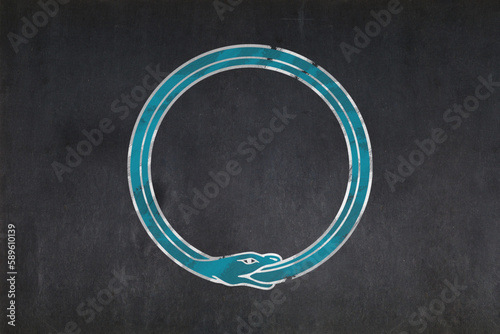 Ouroboros symbol drawn on a blackboard photo