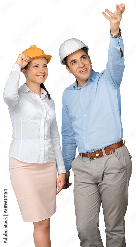Young couple in protective helmets isolated on white background Young couple in protective helmets isolated on white background