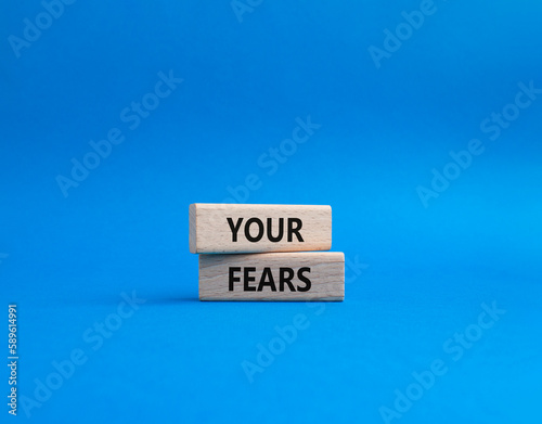 Your fears symbol. Wooden blocks with words Your fears. Beautiful blue background. Business and Your fears concept. Copy space.