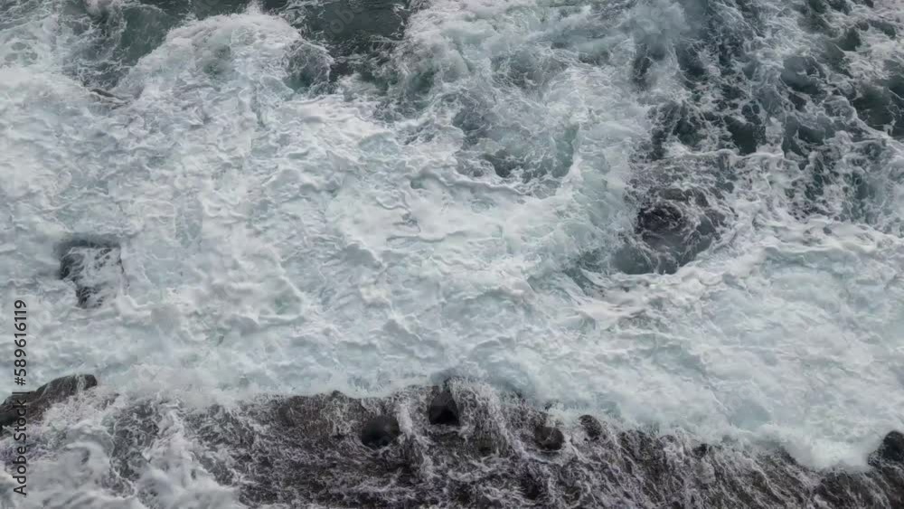 Water splashes from crashing waves on the coast. Rest on the sea. The power of water and nature Water splashes from crashing waves on the coast. Rest on the sea. The power of water and nature