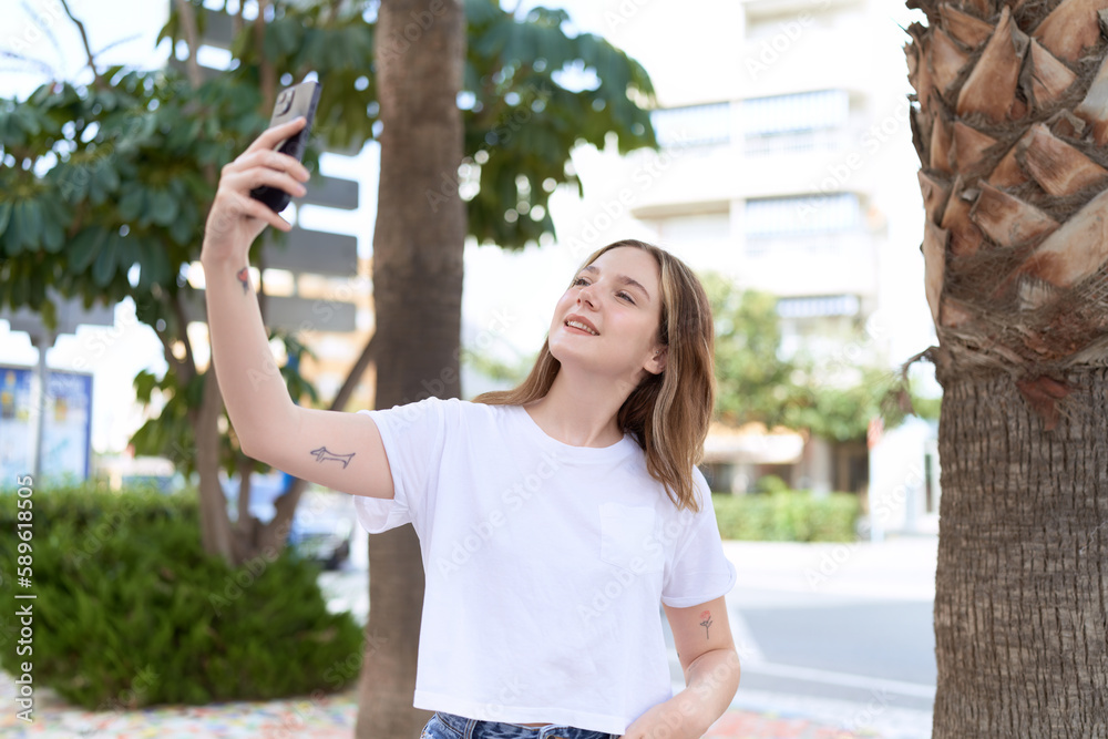 Young caucasian woman smiling confident making selfie by the smartphone at park Young caucasian woman smiling confident making selfie by the smartphone at park