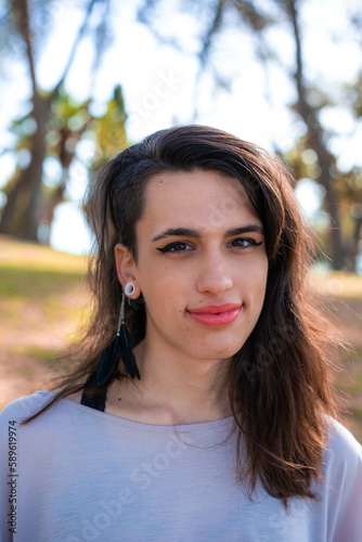 Young latin transgender woman wearing casual clothes happy face smiling looking at the camera. positive person.