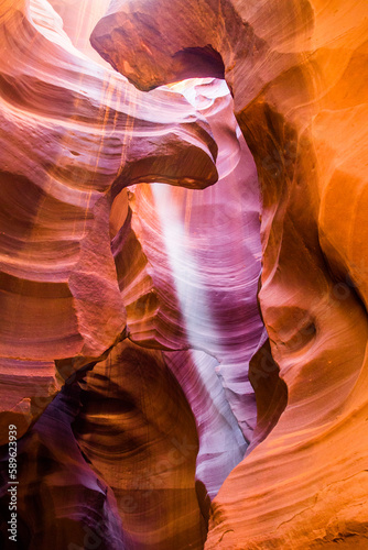 Light beams at Upper Antelope Canyon in the Navajo Reservation Page Northern Arizona. Most famous slot canyon. Light showing off the glamorous detail of the ancient spiral rock arches. Rock formation,