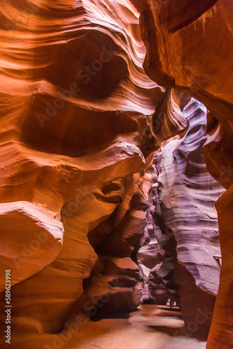 Antelope Canyon in the Navajo Reservation Page Northern Arizona. Famous slot canyon. Light showing off the glamorous detail of the ancient spiral rock arches. Rock formation, game of lights.
