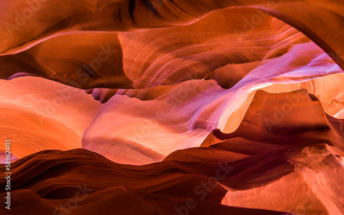 Antelope Canyon in the Navajo Reservation Page Northern Arizona. Famous slot canyon. Light showing off the glamorous detail of the ancient spiral rock arches. Rock formation. Little Monument Valley.