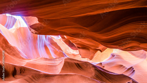 Antelope Canyon in the Navajo Reservation Page Northern Arizona. Famous slot canyon. Light showing off the glamorous detail of the ancient spiral rock arches. Colorful Light in Upper Antelope Canyon. 