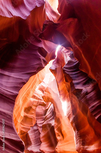 Antelope Canyon in the Navajo Reservation Page Northern Arizona. Famous slot canyon. Light showing off the glamorous detail of the ancient spiral rock arches. Multicolored texture, rock formation, gam