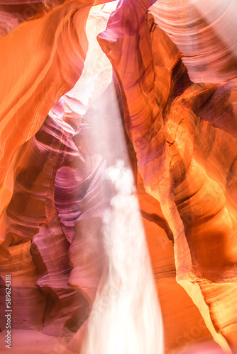 Upper Antelope Canyon in the Navajo Reservation Page Northern Arizona. Famous slot canyon. Light showing off the detail of the rock arches where the falling sand looks like a ghost Majesty.