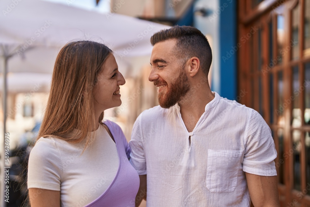 Man and woman couple smiling confident hugging each other at street Man and woman couple smiling confident hugging each other at street