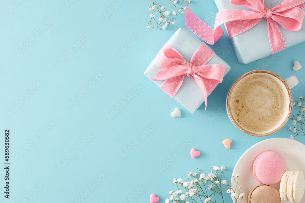 Mother's Day concept. Flat lay photo of gift boxes with bows cup of coffee plate with macaroons small hearts baubles and gypsophila flowers on isolated pastel blue background with copyspace Mother's Day concept. Flat lay photo of gift boxes with bows cup of coffee plate with macaroons small hearts baubles and gypsophila flowers on isolated pastel blue background with copyspace