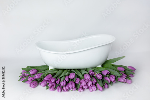 baby bath with tulips. pink tulips. baby bath. purple flowers