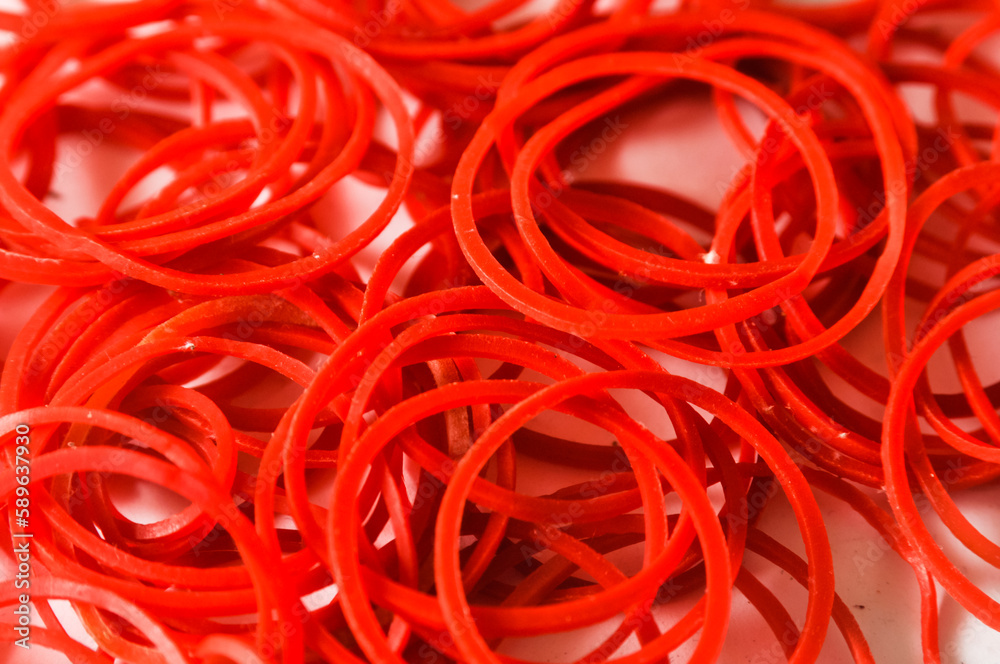 Stacks or groups of red rubber bands can be used as a background