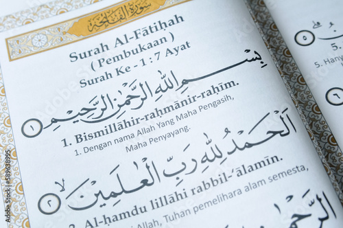 Prayer book open on the page containing Surah Al Fatihah of Holy Quran photo