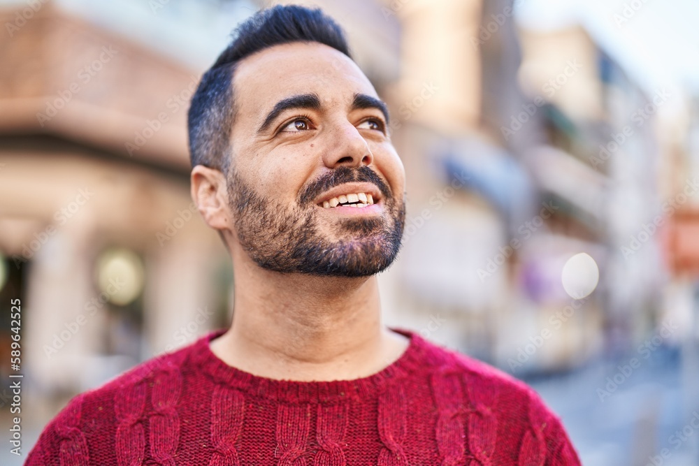 Young hispanic man smiling confident standing at street Young hispanic man smiling confident standing at street