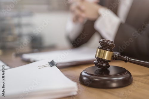 lawyer or judge counselor reading a important legal contract documents in office..