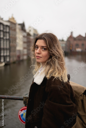 Young beautiful tourist woman in Amsterdam.